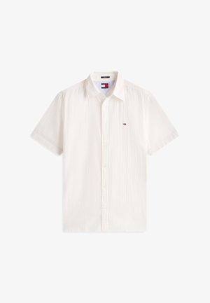 Valge lühikeste varrukatega nööbitav särk tekstureeritud kangaga ning väikese Tommy Hilfigeri logoga vasakul rinnal.