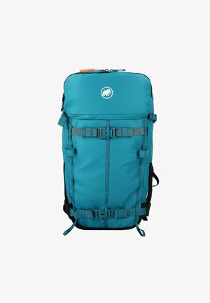 Turquoise rugzak met een glad nylon oppervlak, verstelbare banden, zwarte accenten en een logo met een olifant. Voorzien van meerdere gespen en vakken.