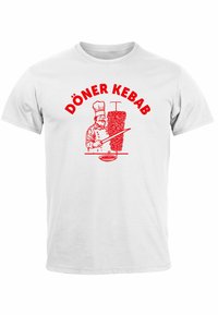 White t-shirt featuring a red illustration of a chef with a knife and a vertical kebab stack, text reads "DÖNER KEBAB" in bold red letters.