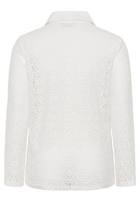 Veste blanche à manches longues avec motifs géométriques et floraux complexes rappelant de la dentelle, dotée d'un col et d'un ourlet droit, vue de dos.