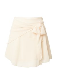 Lichtbeige, wikkelrok gemaakt van zachte stof, met een strikdetail in de taille en een vloeiende, gelaagde ontwerpen met een ongelijkmatige zoom.