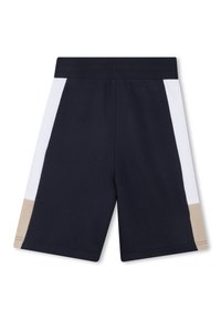Shorts d'athlétisme navy avec des panneaux latéraux blancs et beiges, une taille élastique et un tissu en coton doux. Design épuré et minimaliste.