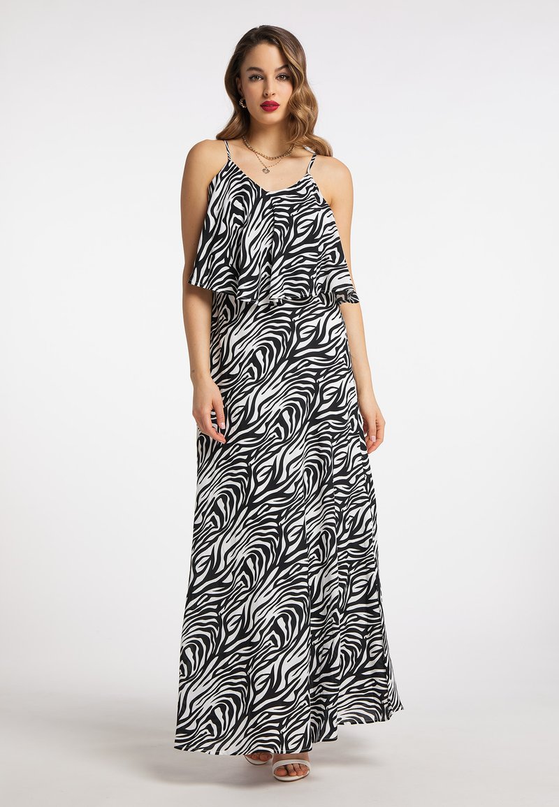 Maxikleid im schwarz-weißen Zebra-Muster, mit Spaghetti-Trägern und einem fließenden Überwurf. Glattes Material mit entspannter Passform.