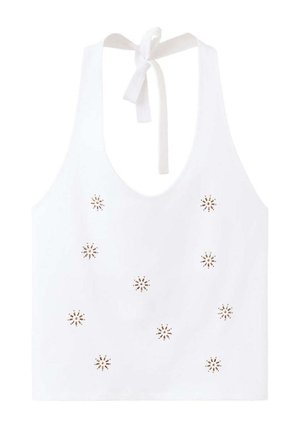 White halter crop top with tie neck and small symmetrical floral cutout designs on front.