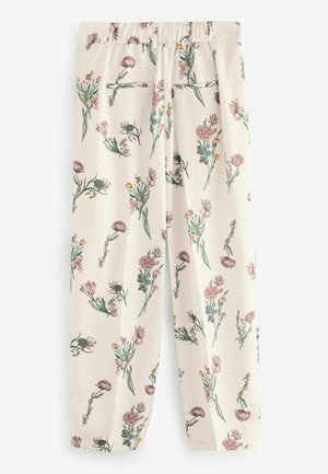 Crèmekleurige broek met bloemenpatroon en elastische tailleband, met een mix van roze en gele bloemen en groene stelen.
