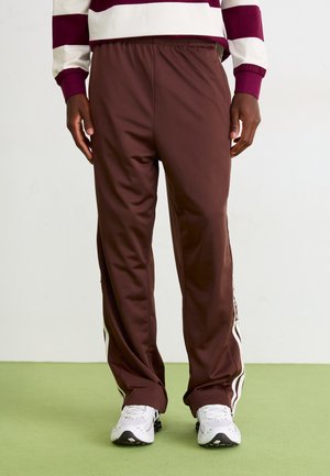 ADIBREAK - Tracksuit bottoms - auburn/off white