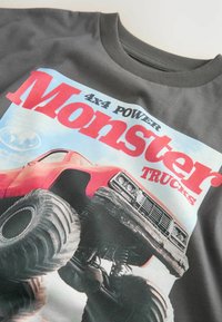 Unselected, charcoal grey truck