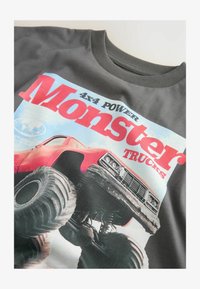 Unselected, charcoal grey truck