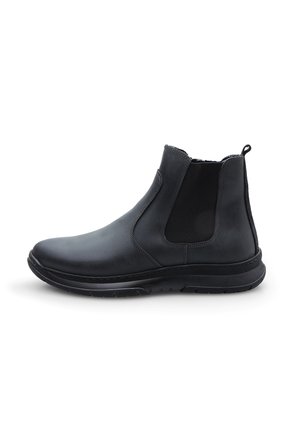 Bottine Chelsea en cuir noir avec des panneaux élastiques sur les côtés, un col texturé et une semelle en caoutchouc pour une meilleure traction. Design épuré et élégant.