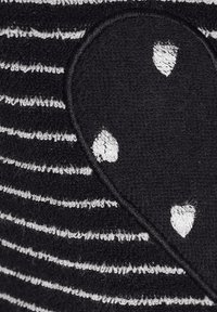 Black and gray striped fabric featuring a textured heart-shaped patch in solid black with white accents. Soft and plush surface.