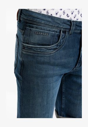Tumedat denim teksad, millel on veidi kulunud tekstuur, tagakotil Gabbiano logo ja standardne viie tasku disain.