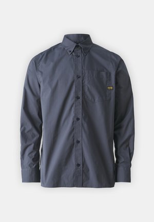 Navy blue button-up shirt made of smooth fabric, featuring a collar, long sleeves, front pocket, and a logo patch on the chest.