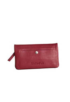Red textured leather wallet with a snap button closure and embossed "Antoine & Lili" branding on the front.