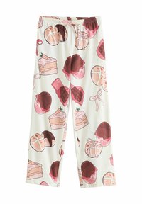 Hvide pyjamasbukser med elastisk talje, der har et gentaget mønster af forskellige desserter i pink, brun og cremefarvet.