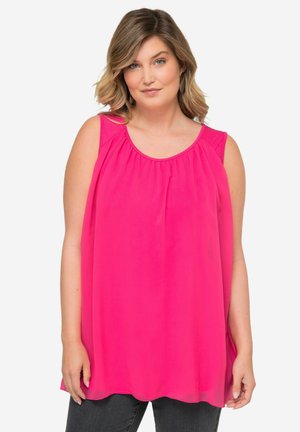 Top ampio senza maniche di colore rosa brillante, realizzato in tessuto leggero. Presenta un collo rotondo e dettagli arricciati per un volume maggiore.