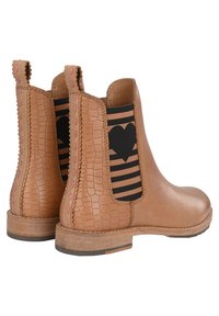Tan leather ankle boots with a textured croc pattern, elastic side panels featuring black stripes and heart design, and a low wooden heel.