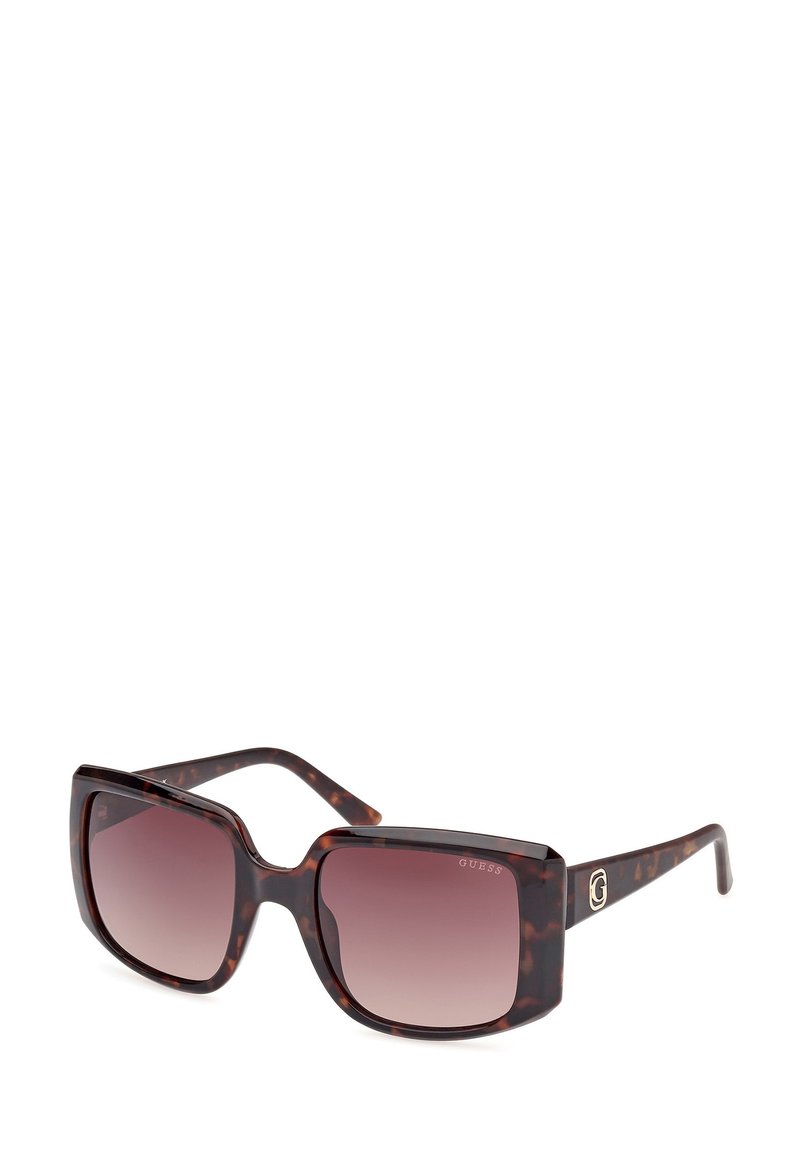 Ochelari de soare tortoise browni cu lentile gradient. Design cu ramă pătrată și un logo subtil pe braț. Textură netedă și brațe groase.