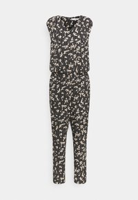 Combinaison noire avec un motif floral en tons crème, coupe décontractée, manches courtes et jambes fuselées. Texture à rayures fines visible.