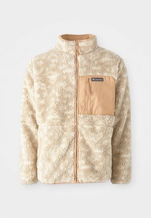 Veste en polaire beige avec fermeture éclair sur tout le devant, tissu texturé et poche poitrine zippée couleur sable étiquetée Columbia.