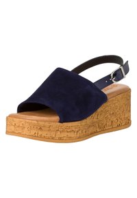Sandalo con zeppa in suede blu navy, piattaforma in sughero, punta aperta e cinturino posteriore regolabile. Morbido al tatto con una leggera lucentezza.