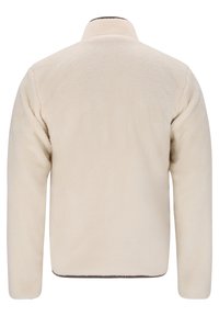 Chaqueta de forro polar color crema con cuello alto y mangas largas. Textura suave y costuras mínimas, con un dobladillo recto.