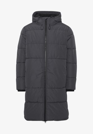 Pārklājošā puse tumšā pelēkā krāsā, ar vidēju garumu, rāvējslēdzēja aizdari, regulējamu kapuci un ribotām piedurknēm ērtībai un siltumam.