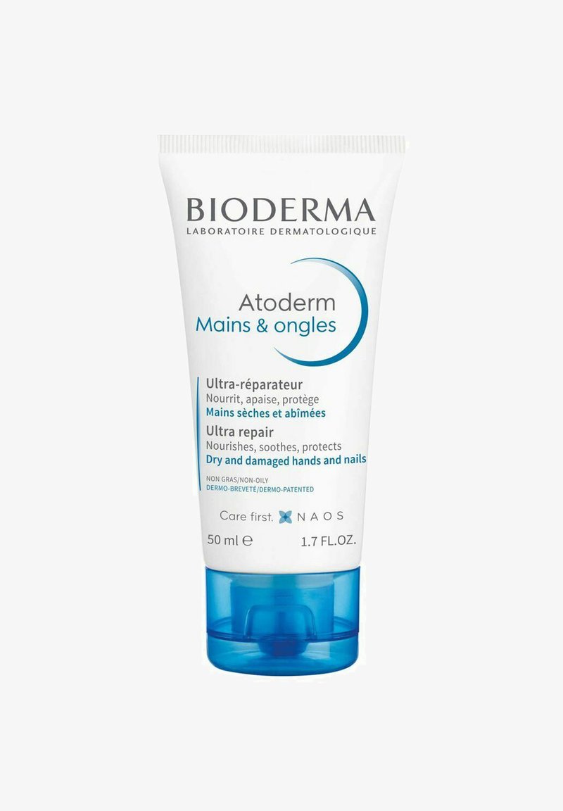 Tube de 50 ml de crème pour les mains et les ongles Bioderma Atoderm. Blanc avec des accents bleus, équipé d'un bouchon à rabat et comprenant du texte en français et en anglais.