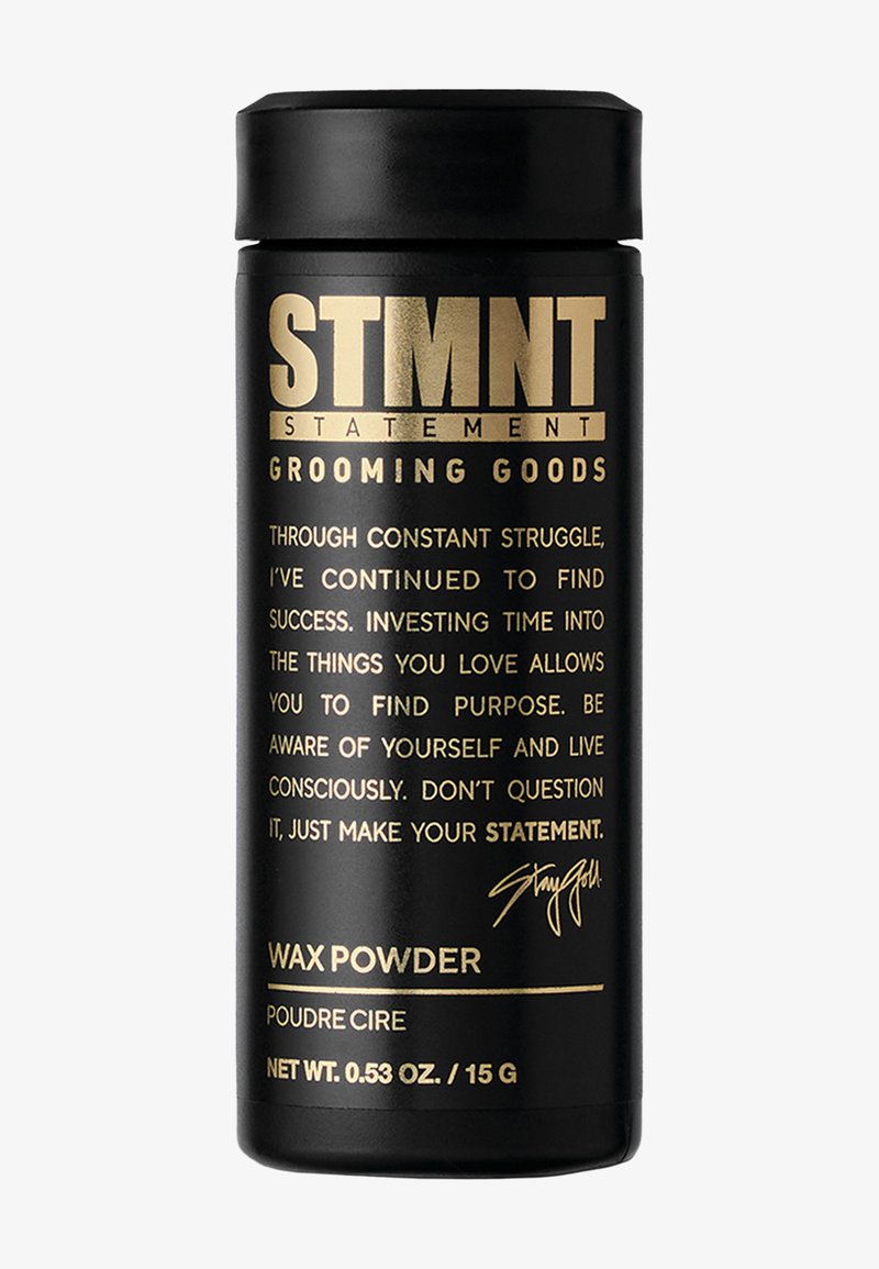 Svart cylindrisk behållare med guldfärgad text, märkt "WAX POWDER." Innehåller varumärke och produktbeskrivningar, matt finish och elegant design.