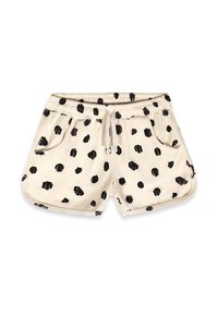 Short beige avec des taches noires irrégulières, taille élastique, cordon, deux poches avant et ourlets arrondis.