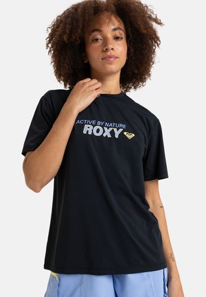 Black active T-shirt featuring "ACTIVE BY NATURE" and "ROXY" printed in light blue and yellow. Soft fabric with a relaxed fit and short sleeves.