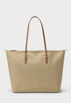 Borsa a spalla in canvas beige con due manici in pelle marrone e dettagli in oro, dotata di chiusura con zip e un discreto logo sulla parte anteriore.