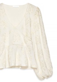 Blouse à manches longues en crème texturée avec un col en V, broderies florales en relief, taille peplum froncée et poignets bouffants.
