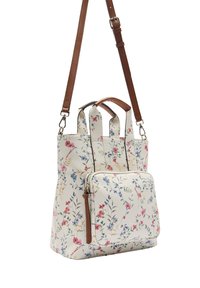 Kwiatowa torba na ramię w kremowym kolorze z rączkami i detalami ze skóry. Posiada dużą główną przegrodę oraz przednią kieszeń na zamek.