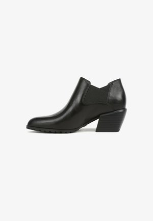 Stivaletto in pelle nera con tacco basso a blocco impilato e pannelli laterali elasticizzati, mostrato di profilo su sfondo bianco.