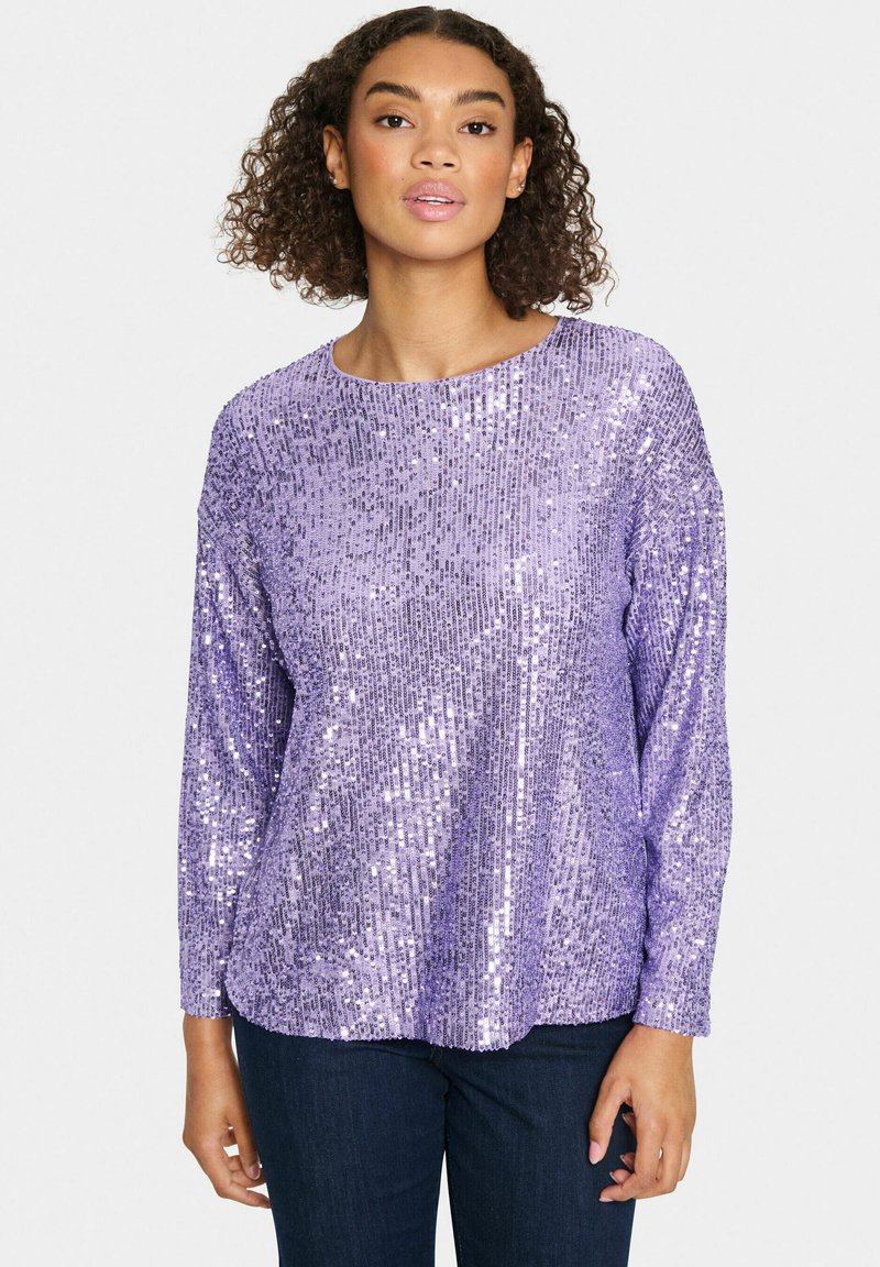 Purple sequin top with long sleeves and a round neckline, featuring a textured surface of shimmering sequins in a vertical pattern.