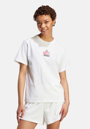 White cotton t-shirt with a round neck and short sleeves, featuring a pink pineapple and "Adidas" logo in green.