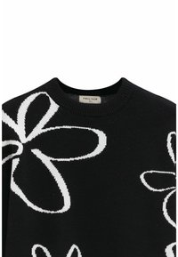 Pull en tricot noir avec de grands motifs floraux blancs, col rond et poignets côtelés. L'étiquette indique "FRILIVIN." Texture lisse.