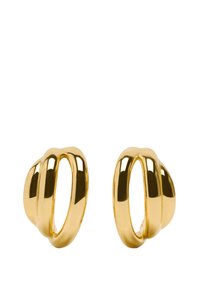 Złote kolczyki w kształcie obręczy o gładkim, wypolerowanym wykończeniu, z falistym wzorem i pustymi sekcjami, tworzące nowoczesny wygląd.
