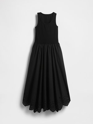 Robe maxi sans manches noire avec un buste de d�ébardeur ajusté et un ourlet en dentelle présentant des motifs de découpes circulaires.