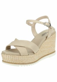 Beige kilehæle sandaler med vævet jute-platform, krydsede stropper og ankelrem. Glat imiteret læderoverdel med tekstureret sål.