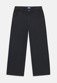 Pantalons larges noirs en tissu mélangé de coton. Comprend des poches avant, une fermeture à bouton et des détails de coutures contrastées.