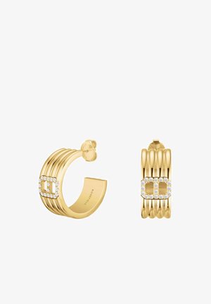 Boucles d'oreilles créoles en or avec un design côtelé, ornées d'un accent en cristaux. Finition lisse, fermoir sécurisé et texture polie.