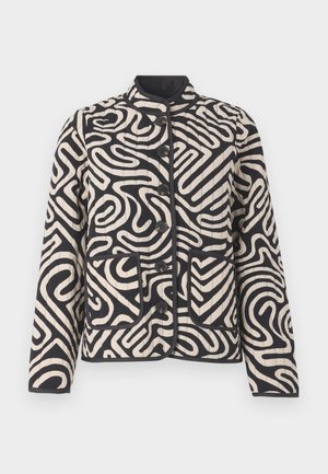 Quilted jacket in cream and black featuring abstract swirling patterns, a mandarin collar, front pockets, and button closure.