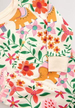 Cotton pajama set with cream background, featuring colorful floral and elephant patterns. Includes ribbed cuffs and pocket detail.