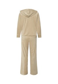Ensemble d’intérieur beige deux pièces avec haut à capuche à manches longues et pantalon à jambes larges, vu de dos sur fond blanc.