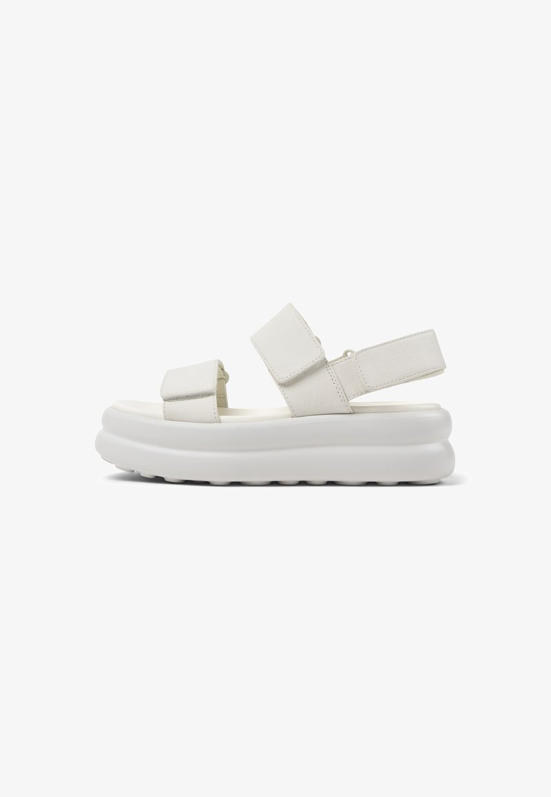 White sporty platform sandal with two adjustable Velcro straps over foot and one at the heel, thick cushioned sole, side view.