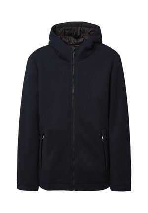Veste zippée bleu marine avec capuche, en tissu texturé, deux poches latérales et une doublure intérieure lisse. Dispose d'un ourlet et de poignets ajustés.
