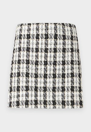 Črno-bela karo krila iz teksturirane tkanine, s strukturiranim dizajnom, naravnost krojeno in z minimalnimi podrobnostmi.