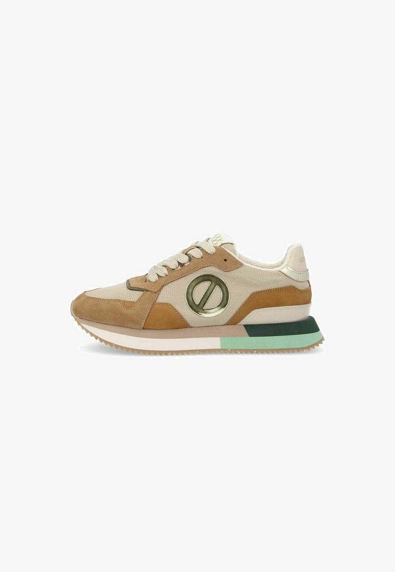 Sneakers with a beige canvas upper, brown suede accents, a green rubber sole, and a prominent circular logo on the side. Minimalist design.