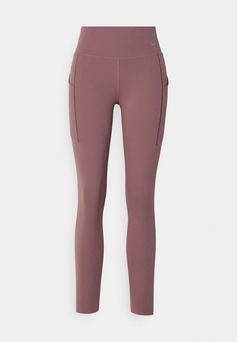 Leggings atletici in un tono di mauve tenue, a vita alta con due tasche laterali, realizzati in un tessuto liscio e elastico con dettagli di cucitura discreti.